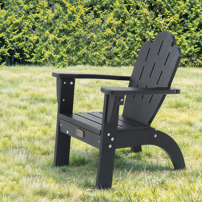 Lifestyle image of Adirondack Children Outdoor Chair in Black outdoors
