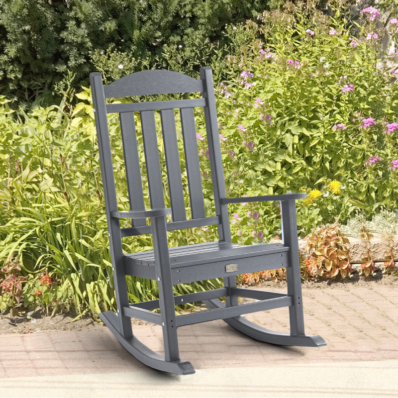 Lifestyle image of Adirondack Outdoor Rocking Chair in Grey outdoors
