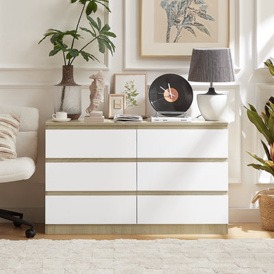 Angled view of Nola 6 Drawers Tallboy in white and brown