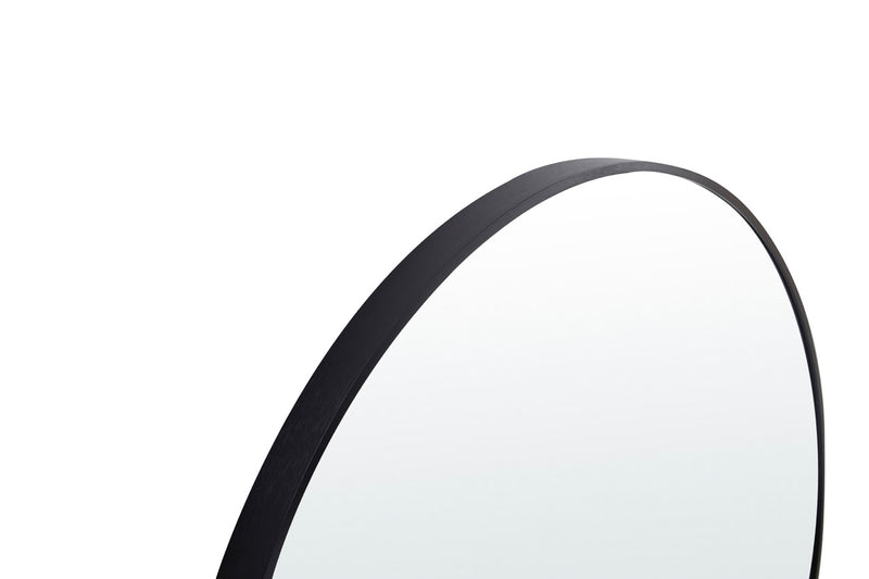 Stella Round Metal Framed Wall Mirror in black color placed in a stylish room setting.