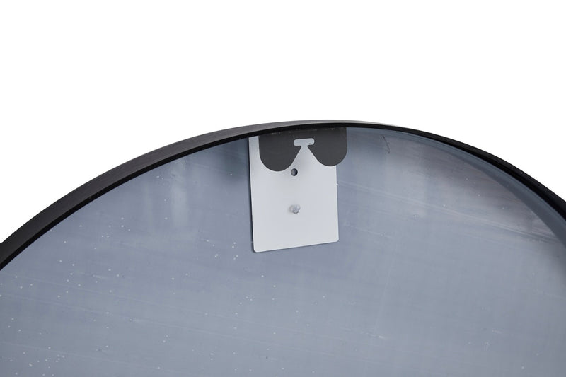 Angled view of the Stella Round Metal Framed Wall Mirror in black color.