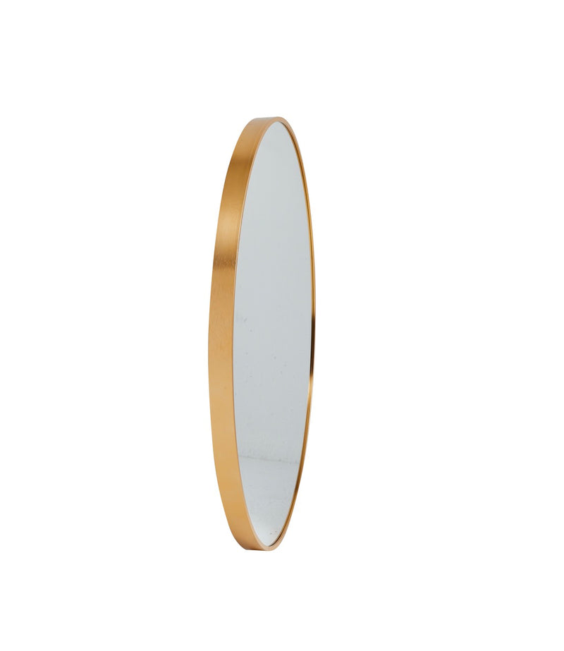 Stella Round Metal Framed Wall Mirror in gold color placed in a stylish room setting.