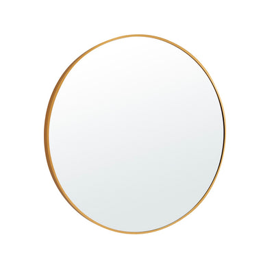 Stella Round Metal Framed Wall Mirror in gold color in a lifestyle view.